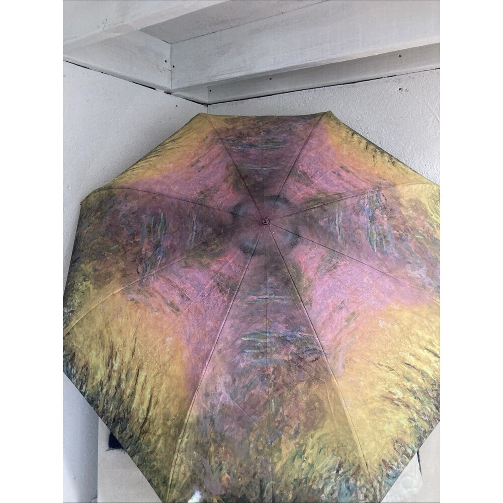 galleria enterprises inc. umbrella money “water lilies at sunset reverse close